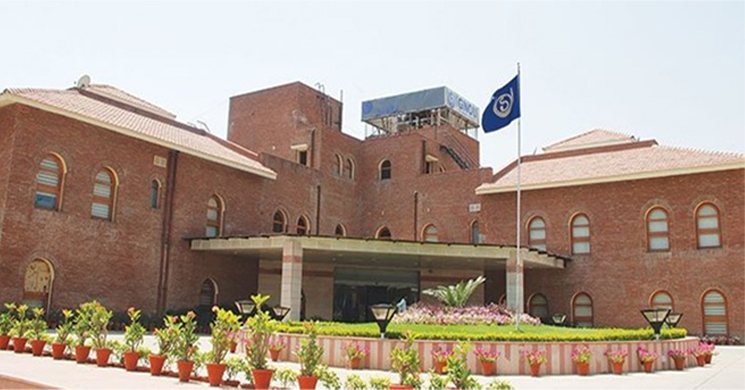 IGNOU campus building with the university flag